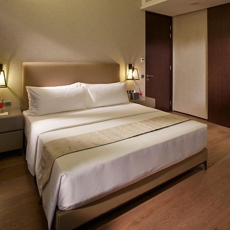 I'M Hotel Makati City Kültér fotó A bedroom at the hotel