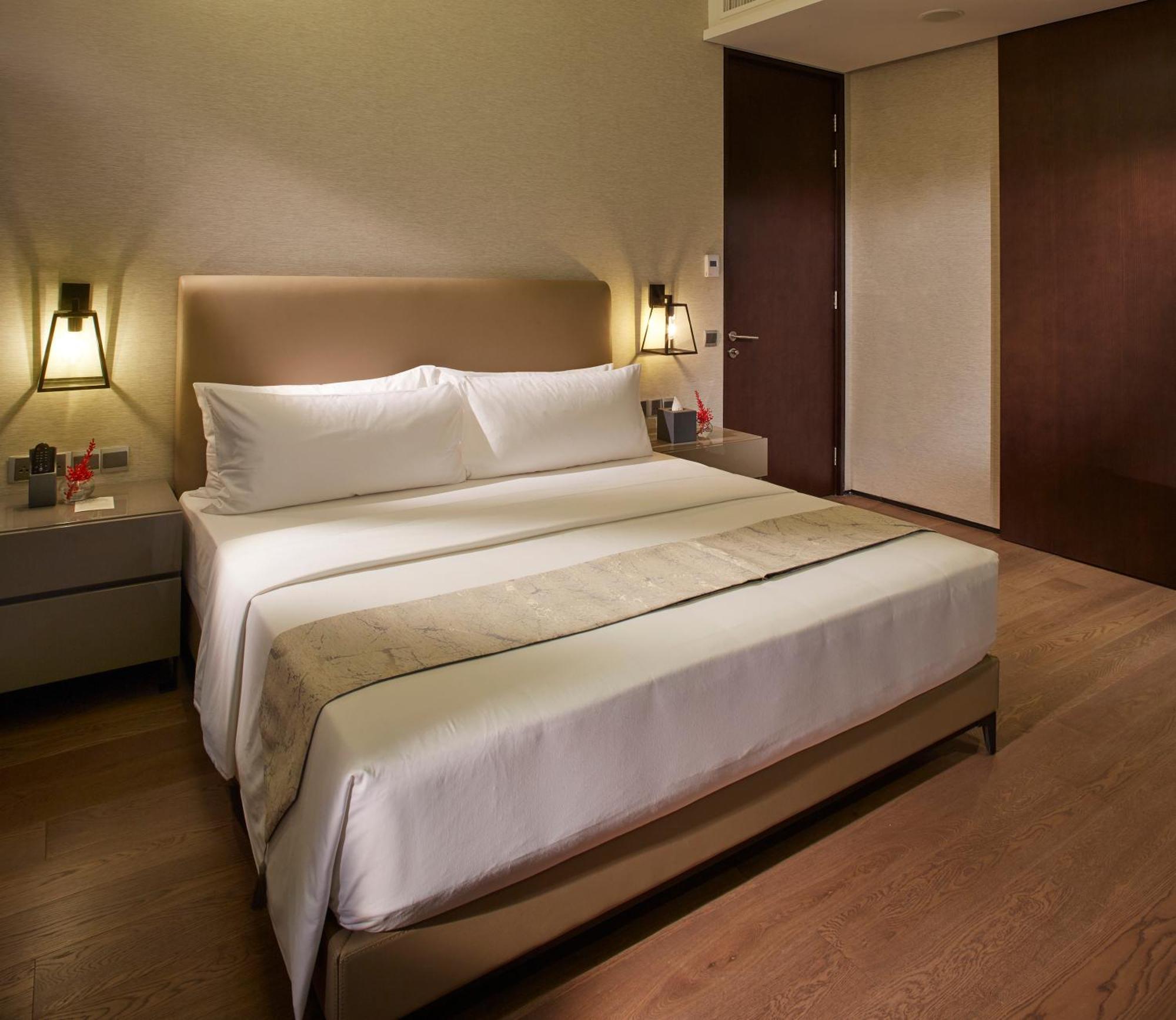 I'M Hotel Makati City Kültér fotó A bedroom at the hotel