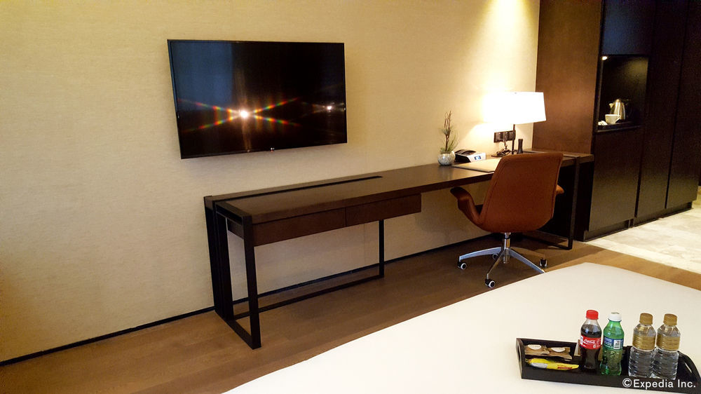 I'M Hotel Makati City Kültér fotó A television mounted on a wall